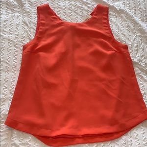 bright peach tank top with detailing on the back